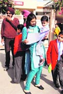 A parent looks at the admission form of Sacred Heart Convent School in Ludhiana