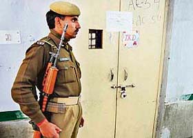 CRPF jawan stands guard outside a counting centre in New Delhi