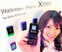 A model shows off Sony Ericsson's new mobile "Walkman Phone, Xmini" in Tokyo on Monday.