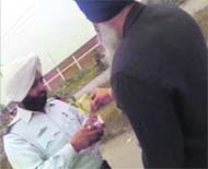 A traffic cop accepting money in lieu of the code