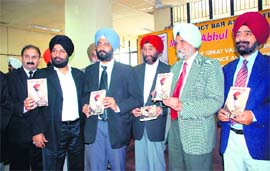 Dr S S Johal, former VC of Punjabi University, releases a book Merian Abhul Yaaden Ate Sunehy, an autobiography penned down by a retired judge Avtar Singh Gill, in Ludhiana on Monday. 