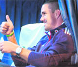 Kevin Pietersen gives a thumbs-up sign as he sits inside the team bus upon arriving in Chennai on Monday.