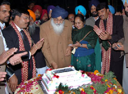 Birthday Bash: Chief Minister Parkash Singh Badal cutting his birthday cake at a function at Malout in the Muktsar district on Monday evening. This was followed by a cultural programme in which noted singer Gurdas Mann was the star performer. 