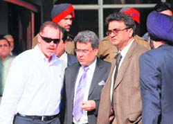 England and Wales Cricket Board (ECB) security adviser Reg Dickason (left) accompanied by PCA officials at the cricket stadium in Mohali