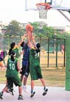 Cagers in action during the Panjab University Inter-College Basketball (Women) A-Division Tournament on the PU campus