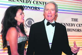 Former Kennedy Center honoree actor and director Clint Eastwood with his wife Dina Ruiz as they arrive for the gala. Photo: Reuters
