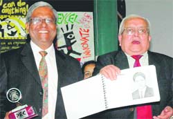 BOG chairman Chander Mohan presents Madan Lal a picture of his yesteryears.