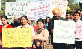 Human rights activists and students take part in a rally at Panjab Universit