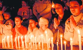 children pay tributes to Mumbai terror attack victims on the Human Rights Day in Sector 17, Chandigarh, on Wednesday.