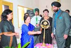 The chief guest light the lamp during the inter-school solo song competition organised at Green Grow Public School in Doraha