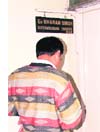 A contractor waits in front of SE Dharam Singhs office, which was locked before the official timing of 5 pm.