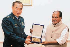 Deputy Chief of General Staff of the People's Liberation Army of China, Lt Gen Ma Xiaotian (left) presents a momento to Defence Minister A.K. Antony in New Delhi