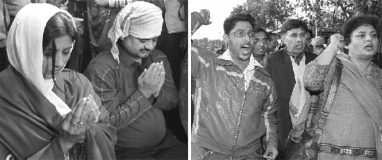 Chand Mohammad (Chander Mohan) and Fiza (Anuradha Bali) pray at a dargah in Panchkula on Thursday; and BJP workers protest against them during their visit.