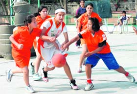 Players struggle to snatch the ball during the ICSE Inter-School Basketball Championship underway at the St Kabir School's courts