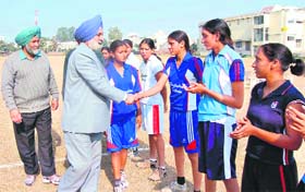 Principal of Government Mohindra College, Dr D.I.S. Brar with players during the inaugural match of Punjabi University Inter-Zonal CarfBall Championship in Patiala