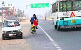 A car driver takes a wrong side at Singpura village to join the Chandigarh-Ambala highway at Zirakpur