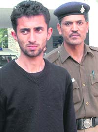 Vikul Nainta, a contractor, being produced before a local court in Chandigarh