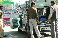 Police check vehicles ahead of the IMA passing out parade, in Dehradun on Thursday.