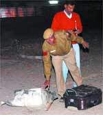 A Delhi policeman checks the broken electronic safe and a suitcase at Baba Khadak Singh Marg, Connaught Place in New Delhi 