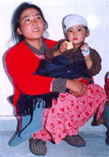 A file photo of a Nepali woman who fought a leopard to save her young daughter in 2004.