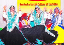 Dancers participate in a cultural function in the Open Air Theatre in Sector 29, Gurgaon
