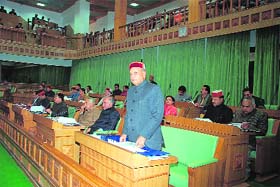Chief Minister Prem Kumar Dhumal addressing the assembly on the first day of the Himachal vidhan sabha at Dharamsala