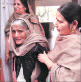 Ambo Devi (102) goes to cast her vote in Katra.