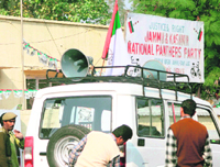 Campaign vehicles fitted with loudspeakers play promotional songs.