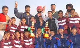 Bathinda and Sangrur with their trophies. The teams were declared joint winners.