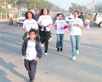 People take part in a marathon organised in Gurgaon on Saturday.