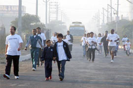 People take part in a marathon at DLF in Gurgaon on Saturday morning.