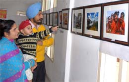 Visitors to the photo exhibition organised by the Bathinda Photographers Association at the Teachers Home on Sunday. 