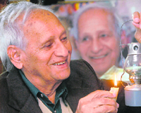 Nek Chand, creator of Rock Garden, lights a lamp on the eve of his 84th birthday at his home in Sector 27, Chandigarh, on Sunday.