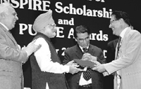 Professor R.C. Sobti, vice-chancellor, Panjab University, receives PURSE award from the Prime Minister, Dr Manmohan Singh, in New Delhi on Saturday at the launch of INSPIRE-Innovation of Science Pursuit for Inspired Research, a scholarship programme of the Department of Science and Technology.