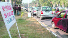 Cars parked on the road leading to the Stu-C in Panjab University.
