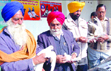 Judges examine different breeds of pigeons at Shere-e-Punjab Maharaja Ranjit Singh pigeon flying and breed show club at Jalandhar on Sunday.