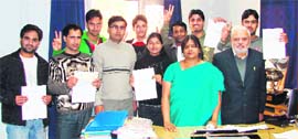 Salini Gupta, director general Bhagat Group of Institutes, gives certificates to the students after completing the research project at Mandi Gobindgarh on Saturday.