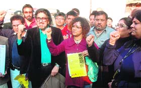 Artistes from Mumbai, under the banner of "Stayin Alive", raise slogans during a peace rally in New Delhi