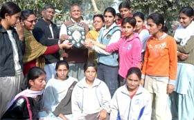 The team members of Saraswati Girls College, Hanumangarh, pose with the trophy they won in the inter-college baseball tournament organised by the Bikaner University