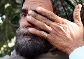 A relative grieves over the death of 22-year-old Inderjit Kaur, who hailed from Bhaini village in Nathana