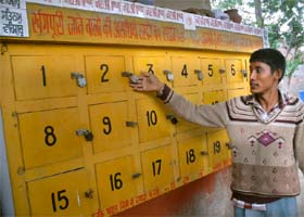 A caretaker of the cremation ground in Bathinda shows rusted locks of the lockers where ashes of the departed have been lying from the past many years