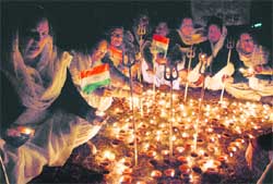 Members of Nari Jagriti Manch pay tributes to the Mumbai terror victims at Sector 40 in Chandigarh