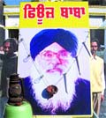 Novel Protest: Shiv Sena (Bal Thackeray) activists place a garland of fused bulbs and candles on a poster of the CM in Kapurthala on Monday.