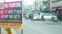 Vehicle owners defy an administration order on parking in Nawanshahr.