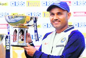 Virender Sehwag poses with Man of the Match trophy