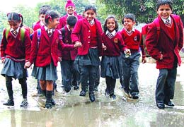 Kids play in water soon after rain in Jalandhar on Tuesday. 