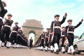 Soldiers march at Amar Jawan Jyoti at India Gate in New Delhi on Tuesday on the occasion on the 37th anniversary of Vijay Diwas