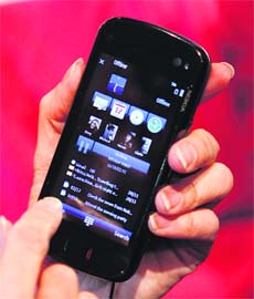 In this file photo, a model holds a new Nokia N97 phone during the Nokia World 08 congress in Barcelona