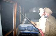 fire brigade officials dousing the flames