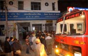 police officials and NGO volunteers outside the SBI branch in Bathinda on Wednesday night